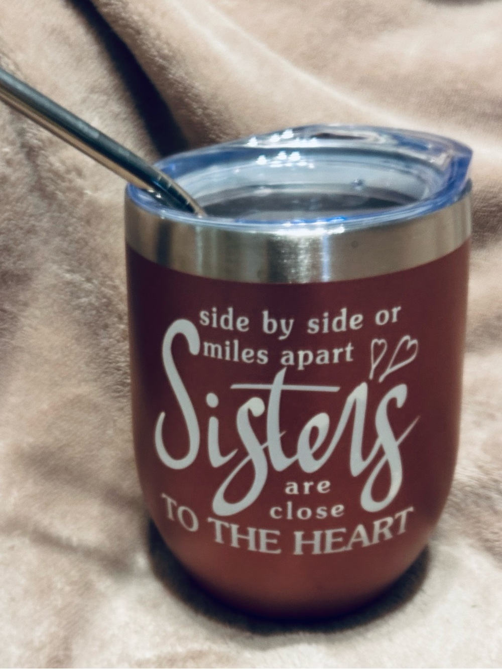 Sisters Insulated Tumbler with spill resistant lid and stainless steel straw.